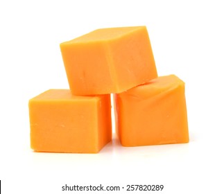 Cubes Of Cheddar Cheese Isolated On White 