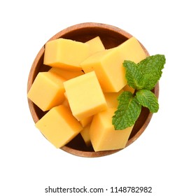 Cubes Of Cheddar Cheese Isolated In Wooden Bowl On White 