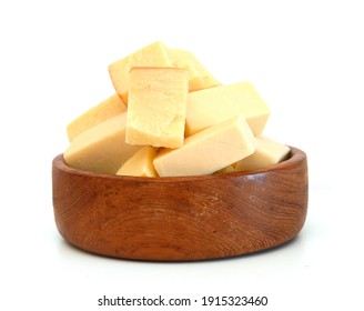 Cubes Of Cheddar Cheese Isolated In Wooden Bowl On White 