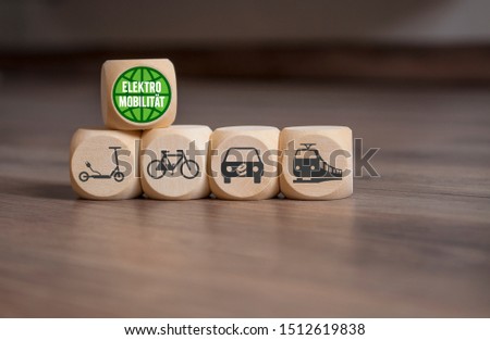 Cubes and dice with e-mobility icons and the german word for e-mobility - Elektromobilitaet