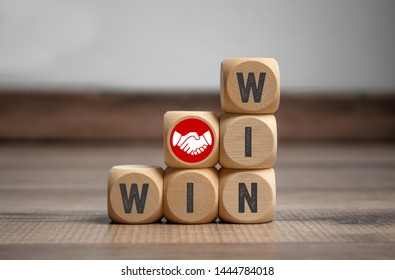 Cubes and dice with handshake icon and win-win-situation  - Shutterstock ID 1444784018