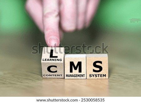 Cubes form the abbreviations CMS (content management system) and LMS (learning management system).