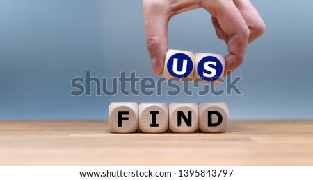 Cubes form the expression "find us".