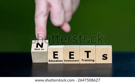 Cubes form the expression NEETs ((Not in Education, Employment, or Training). Symbol for people who are currently not in Education, Employment, or Training.