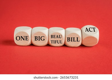 Cubes form the expression One big beautiful bill act. Beautiful red background. Business concept. Copy space.