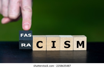 Cubes form the words racism and fascism. Symbol that racism leads to fascism. - Shutterstock ID 2258635487