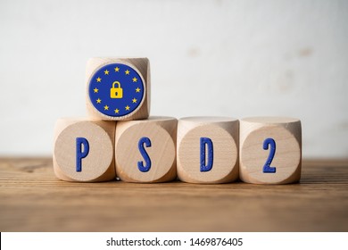 cubes with the message "PSD2 - 2nd Payment Services Directive" on wooden background - Shutterstock ID 1469876405