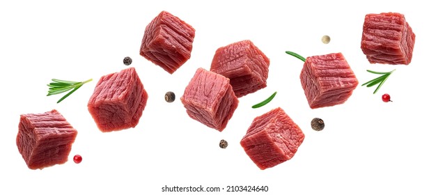 Cubes of raw beef meat isolated on white background - Shutterstock ID 2103424640