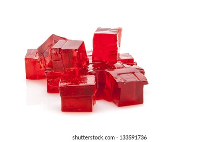 Cubes of red jelly on white background