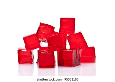 Cubes of red jelly on a white background
