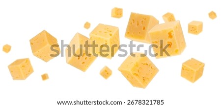 Cubes of regular cheese fly and levitate in space. Isolated on white.