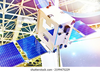 Cubesat miniature satellite with solar panels on space exhibition - Powered by Shutterstock