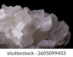 Cubic calcite crystals featuring sharp edges and stunning white mineral structures.
