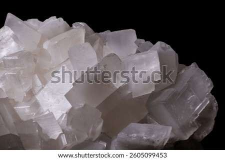 Cubic calcite crystals featuring sharp edges and stunning white mineral structures.
