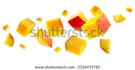 Cubic and triangular mango pieces form an unusual figure in space. Isolated on white