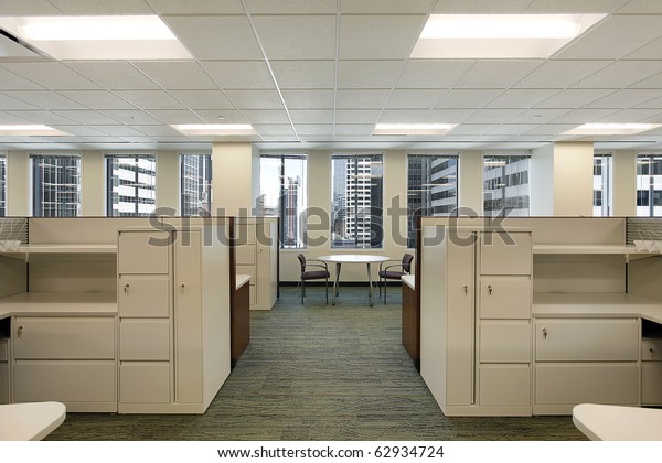 Cubicles\
and meeting area in a downtown office\
building