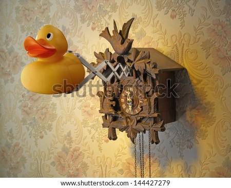Cuckoo Clock and Rubber Duck coming out against flowery wallpaper