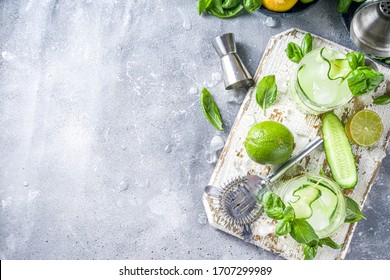 Cucumber Basil Smash Gin And Vodka Alcohol Cocktail. Infused Summer Mocktail With Fresh Basil Leaves, Citrus Fruit And Cucumber,