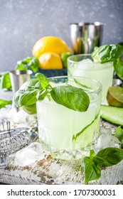 Cucumber Basil Smash Gin And Vodka Alcohol Cocktail. Infused Summer Mocktail With Fresh Basil Leaves, Citrus Fruit And Cucumber,