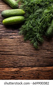 Cucumber And Dill On Very Old Rustic Oak Table.