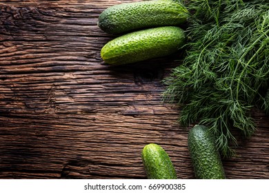 Cucumber And Dill On Very Old Rustic Oak Table.