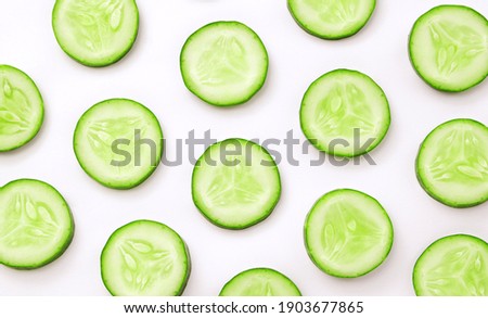 cucumber sliced top view on white  background , flat lay.
