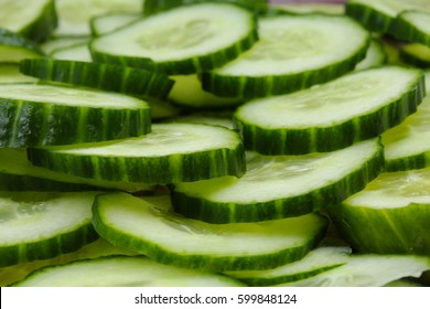 Cucumber slices as background. Green fresh cucumbers as background.