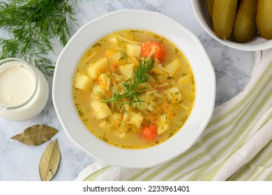 Cucumber soup - traditional Polish soup with pickled cucumbers, potatoes, carrots and dill - Shutterstock ID 2233961401