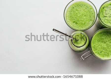 Similar – Foto Bild Grünkohl Smoothie im Glas auf weißem Holzgrund.