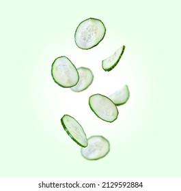 Cucumbers are flying in the air. Levitation on green background - Shutterstock ID 2129592884