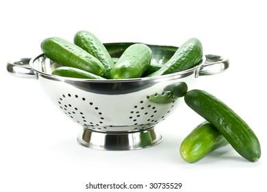 cucumbers in a stainless steel colander parts kitchen group community fire food splash dining fresh healthy heat green eating feeding planning mature pure vital healthful elements gathering partnershi