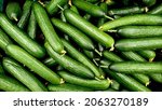 Cucumbers top view, greenhouse cucumbers, long cucumbers, vegetables harvest, food background, place for text 