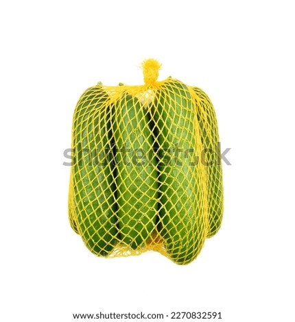 Cucumbers in a yellow mesh packaging bag isolated on white background