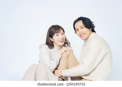 Cuddling Asian casual couple. Commemorative photo of the couple. Pair look. - Powered by Shutterstock