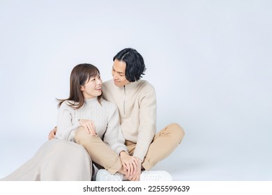 Cuddling Asian casual couple. Commemorative photo of the couple. Pair look. - Powered by Shutterstock