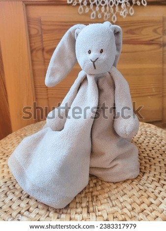 Cuddly cloth for kids resting on a mat.