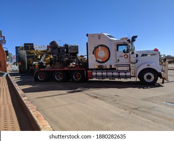 Cue, Western Australia, 7 24 2020.
Large Roadtrain Truck Pulling Out Of A Fuel Stop, And Moving To The Right Of Frame.