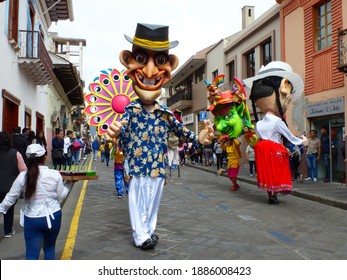 Cuenca, Ecuador - February 22, 2020: Parade during the carnival in the historic center of city Cuenca. Giant mannequins in costumes typical for Azuay province 