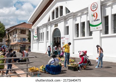 Cuenca, Ecuador - January 23, 2022: Food market '9 de Octubre' in Cuenca. Venders of fresh vegetables and fruit sells their products in front of market building. Cuenca, Ecuador