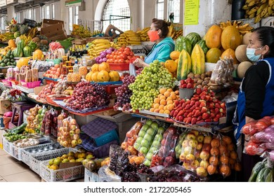 Cuenca, Ecuador - January 6, 2022: Food market '9 de Octubre' in Cuenca. Women-venders in vegetable and fruit department. Ecuador