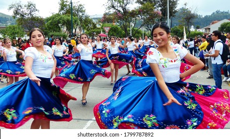 Cuenca, Ecuador - November 1, 2019: Traditional parade on day of  independence of Cuenca. Young women folk dancers in typical dress of Azuay province (cuencanas)