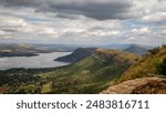 Cuestas, landforms of tilted rock layers or strata, on the north shore of Hartbeespoort dam under a cloudy sky in the Magaliesberg mountain range in North West province in South Africa.