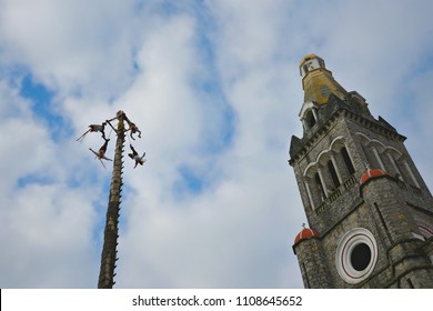 Cuetzalan Del Progreso, Puebla Mexico. May 23, 2018. Flying Dancers Performing The Dance Of The Flyers Ritual Around The 30 Meter Tree Pole Front Of The Parroquia De San Francisco De Asís. 