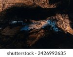 cueva de los verdes, colorful vulcanic rocks in cave with lake still calm reflecting, lava tube in Lanzarote, Canary Islands