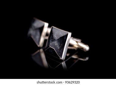 Cuff Links Isolated On Black