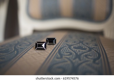 Cuff Links On A Fancy Chair, Black And Silver Cuff Links