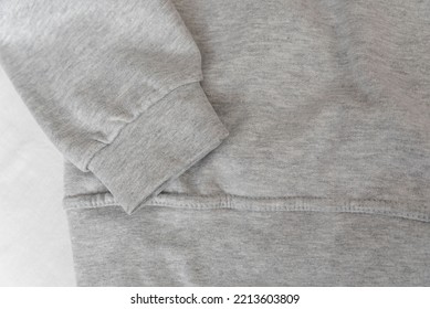 Cuff And Part Gray Sweatshirt On White Background. Warm Casual Unisex Clothing. Close Up.