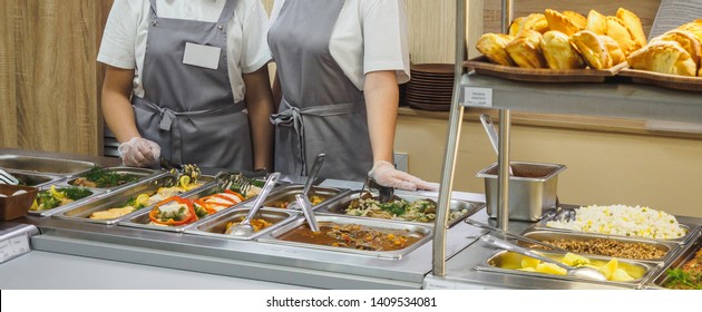 Cuisine cafeteria buffet with food. Self-service food display showcase. - Shutterstock ID 1409534081