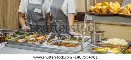 Cuisine cafeteria buffet with food. Self-service food display showcase.