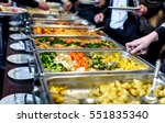 Cuisine Culinary Buffet Dinner Catering Dining Food Celebration Party Concept. Group of people in all you can eat catering buffet food indoor in luxury restaurant with meat and vegetables.